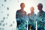 Silhouettes of three business professionals overlaid with a cityscape, featuring various digital icons, representing technology and global connectivity.