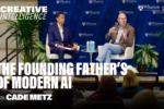 A discussion between two people on stage in front of a Wharton University of Pennsylvania backdrop, with plants and a sign reading "The Founding Father's of Modern AI with Cade Metz."